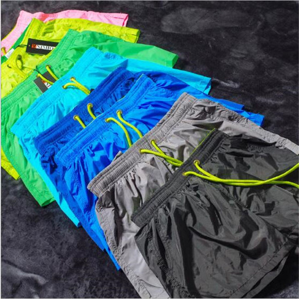 New fitness Solid colored beach shorts running shorts running speed dry pants summer thin training three-minute pants loose running