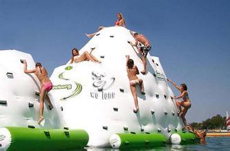 water rock climbing or water iceberg inflatable iceberg playing at water park in hot summer inflatable toy outdoor game