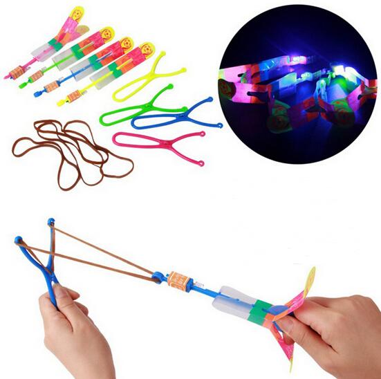 Big Size 50pcs Smile LED FireFly Whistle Flying Arrow Helicopter Flying LED Umbrella Toys SlingShot Toy With Largest Wing YH004