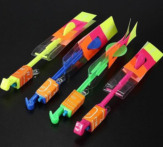 Free Shipping 12PCS Elastic Toy Gift Flash Rotating Flying Arrow Rocket Helicopter LED Light