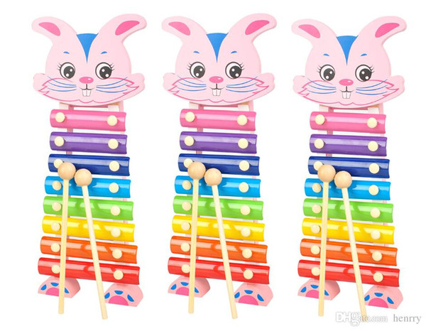 Wholesale Percussion instruments. Serinette white cartoon free hand knock piano music. Kindergarten children's wooden educational toys