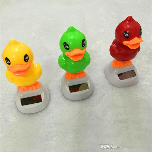 Wholesale- Shaking his head rhubarb duck car interior decorator car Decoration solar energy automatic swing sun flower