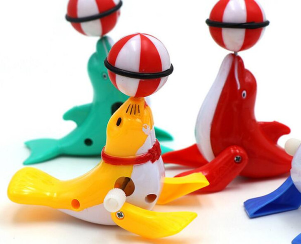 Cross-border foreign trade creative children's puzzle Clockwork cartoon dolphins on the street stall wholesale toys Free shipping