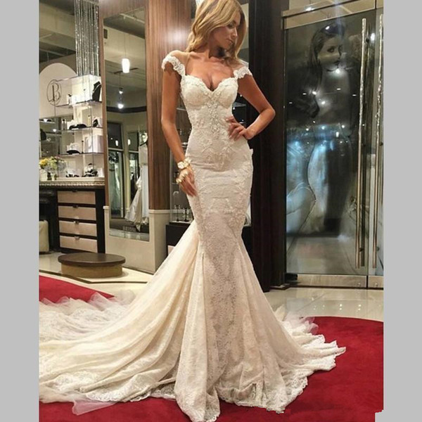 The new sexy Ivory Lace bag, hip tail skirt, inserted 3 corners, inside the multi-layer network wedding dress, shoulders with leakage, back