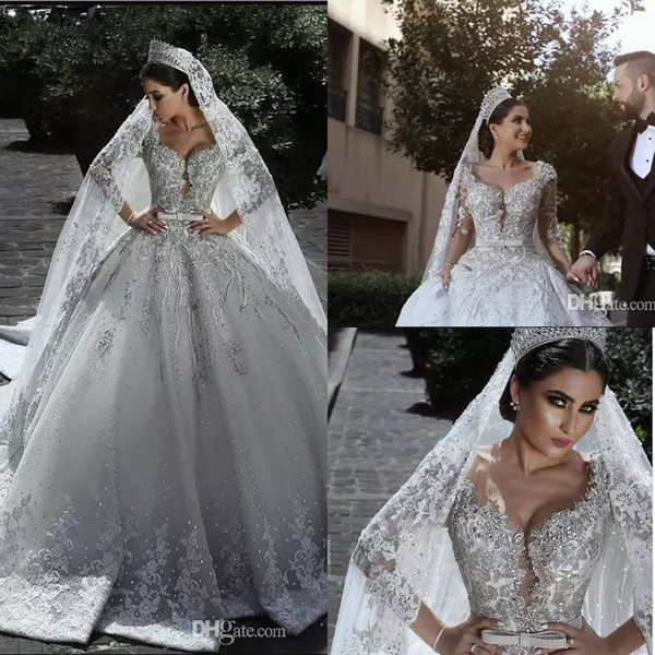 2018 New Luxurious Beaded Arabic Ball Gown Wedding Dresses Glamorous Half Sleeves Tulle Appliques Beaded Sequins Fitted Bridal Gowns