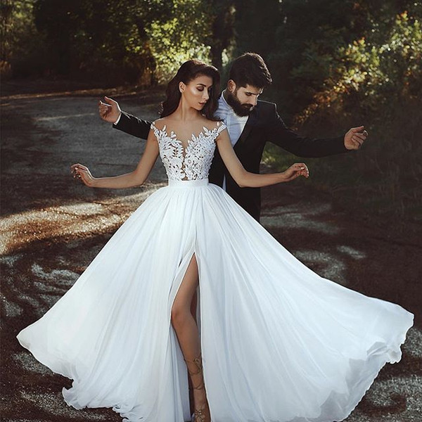 Sexy Backless Wedding Dresses Lace Applique Sheer Jewel-Neck Sleeveless Side Split Wedding Dress Glamorous Dubai Chiffon Bridal Dresses