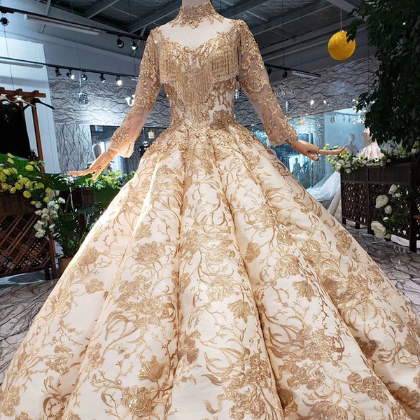 2022Latest Luxury Muslim Evening Dresses Long Sleeve Tassel Neck Lace Up Back Illusion Neckline Gold Pattern Applique Swollen Prom Gowns