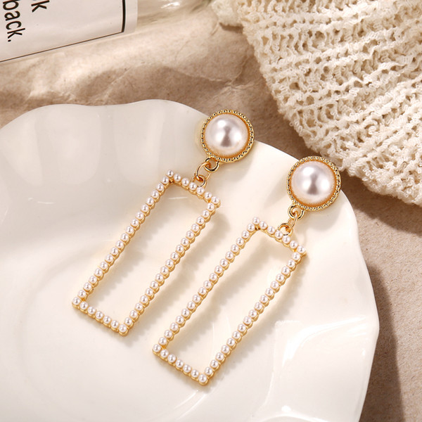 Pearl earrings with geometric trim and elegant earrings