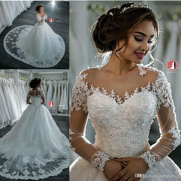 Dubai Elegant Long Sleeves A-line Wedding Dresses Sheer Crew Neck Lace Appliques Beaded Vestios De Novia Bridal Gowns with Buttons