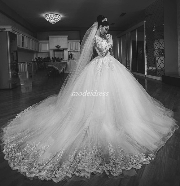 Princess White Ball Gown Wedding Dresses Long Sleeve Sheer Neck Sweep Train Appliques Crystal Beads Chapel Garden Arabic Bridal Gowns