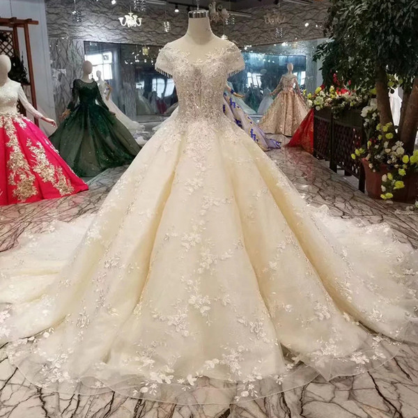 2022Champagne Lace Wedding Dress Elegant O Neck Crystal Cap Sleeves Ball Gown Detail Flower Wedding Gown With Long Train New Fashion Dubai