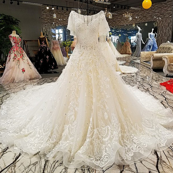 2022Latest Lebanon Wedding Dresses Backless Short Sleeve Tassel Illusion Neckline Beaded Shining Crystal Sequins Pattern Garden Bridal Gown