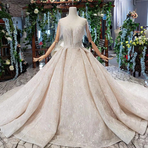 2022Latest Lebanon Wedding Dresses Tassel Short Sleeve Open Keyhole Lace Back Illusion O Neck Crystal Sequins Pattern Bridal Gowns Garden