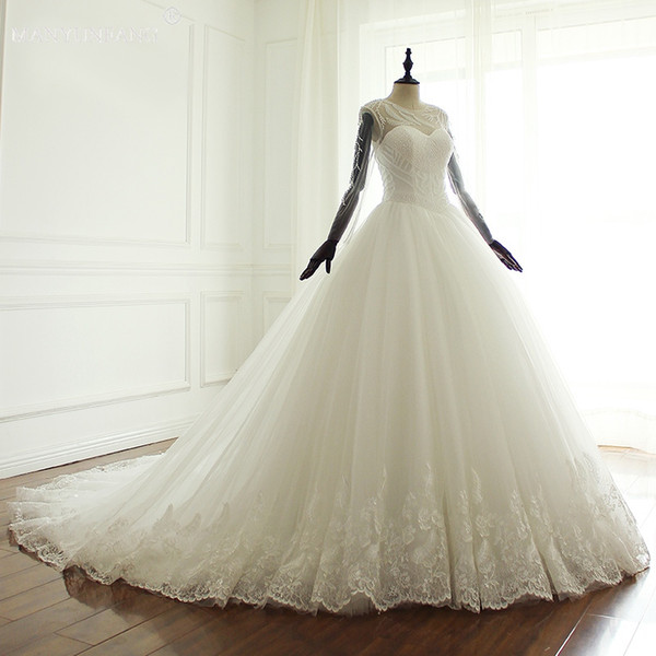 Sheer Long Sleeves Wedding Dresses Sexy Jewel Neck Beaded Applique Court Train With Pearls White Lace Formal Bridal Gowns