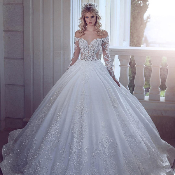 Luxury Ball Gown Wedding Dresses Illusion Off Shoulder Lace Appliques Crystal Beaded Long Sleeves Sweep Train Plus Size Bridal Gowns