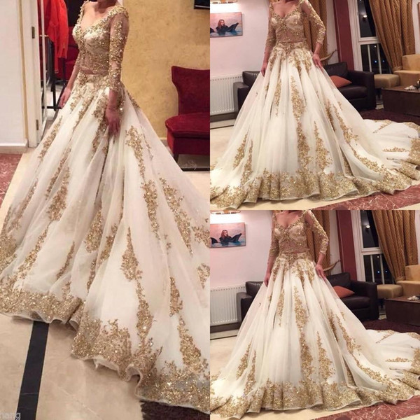 2017 Gold Ball Gown Wedding Dresses with V Neckline Illusion 3/4 Long Sleeves Sequins Beaded Lace Applique Pearls Bling Bridal Gowns