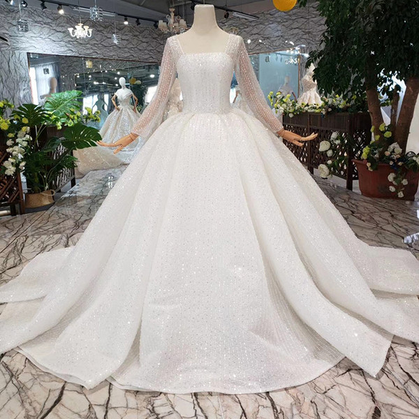 2022Latest Design Wedding Dresses Long Tulle Sleeve Illusion Jewel Neck Covered Button Long Lace Veil Sequins Pattern Beaded Bridal Gowns