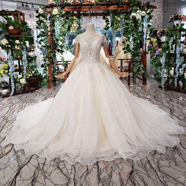 2022Latest Design Wedding Dresses Half Tulle Sleeve Open Keyhole Lace Up Back Illusion O-Neck Sequins Pattern Applique Bridal Gowns Lebanon