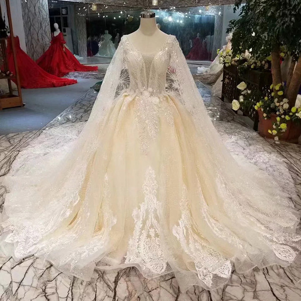 2022Long Tulle Cape Wedding Dresses Luxury Light Champagne Illusion V-Neck Detail Applique Deep V-Back Wedding Gown With Long Train Croatia