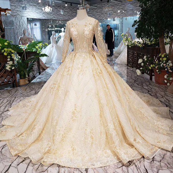 2022Newest Dubai Illusion Deep V Neck Wedding Dresses Long Sheer Sleeve Lace Up Back Shining Sequins Crystal Pearl Garden Bridal Gowns