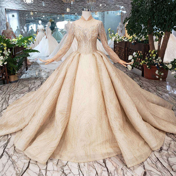 2022Newest Design Dubai Wedding Dresses Long Tulle Sleeve Illusion High Neck Tassel Wedding Gowns Crystal Beaded Garden Bridal Gowns