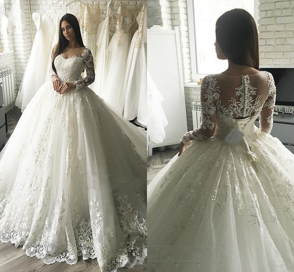 Modest New Arrival Ball Gown Wedding Dresses Lace Appliqued Long Sleeve Sheer Back With Button Covered Belt Long Dubai Arabic Gowns