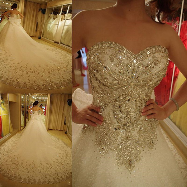 Luxury crystals bling ball gown wedding dresses with bow plus size sweetheart modest rhinestone cathedral train lace up corset bridal gowns