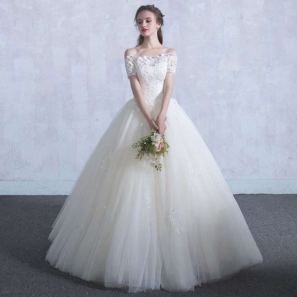 Off the Shoulder Tulle Ball Gown Wedding Dresses with Lace Appliques Short Sleeves Wedding Gown Robe De Mariage