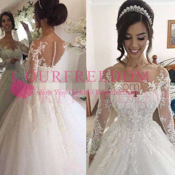 Dubai Arabic Luxury Sparkly Wedding Dresses Illusion Long Sleeve Jewel Neck Lace Appliqued Back Cover Button Church Bridal Gown