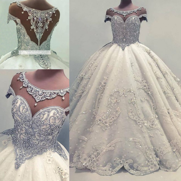 Designer Luxurious Beaded Crystals Arabic Ball Gown Wedding Dresses Sheer Cap Sleeves Beading Sequins Puffy Long Bridal Gowns