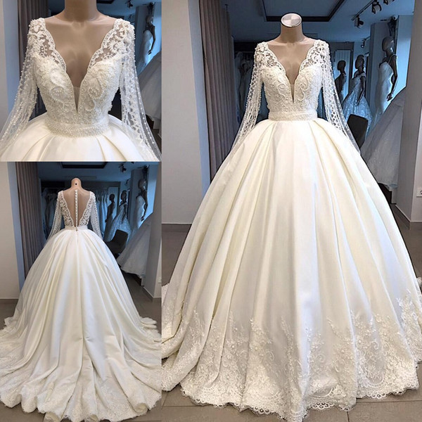 Modest Long Sleeve Ball Gown Wedding Dresses New Sheer Back With Buttons Covered Bead Plunging V Neck Dubai Arabic Bridal Gowns