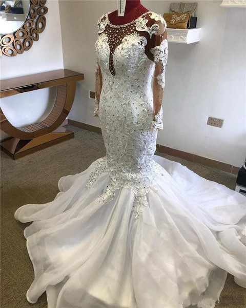 Hot Luxury Mermaid Wedding Dresses Jewel Neck Illusion Lace Appliques Crystal Beaded Long Sleeves Court Train African Bridal Gowns