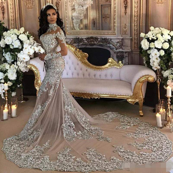 Luxury Sparkly Wedding Dress Sexy Sheer Bling Beaded Lace Applique High Neck Illusion Long Sleeve Champagne Mermaid Chapel Bridal Gown