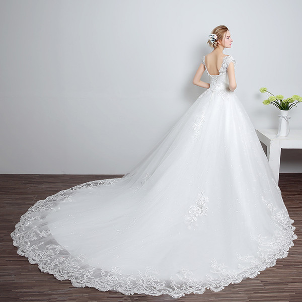 Beautiful long tail wedding dress prints, crystals, sequins decorated sleeveless new long tail wedding dress De Mariee Plus